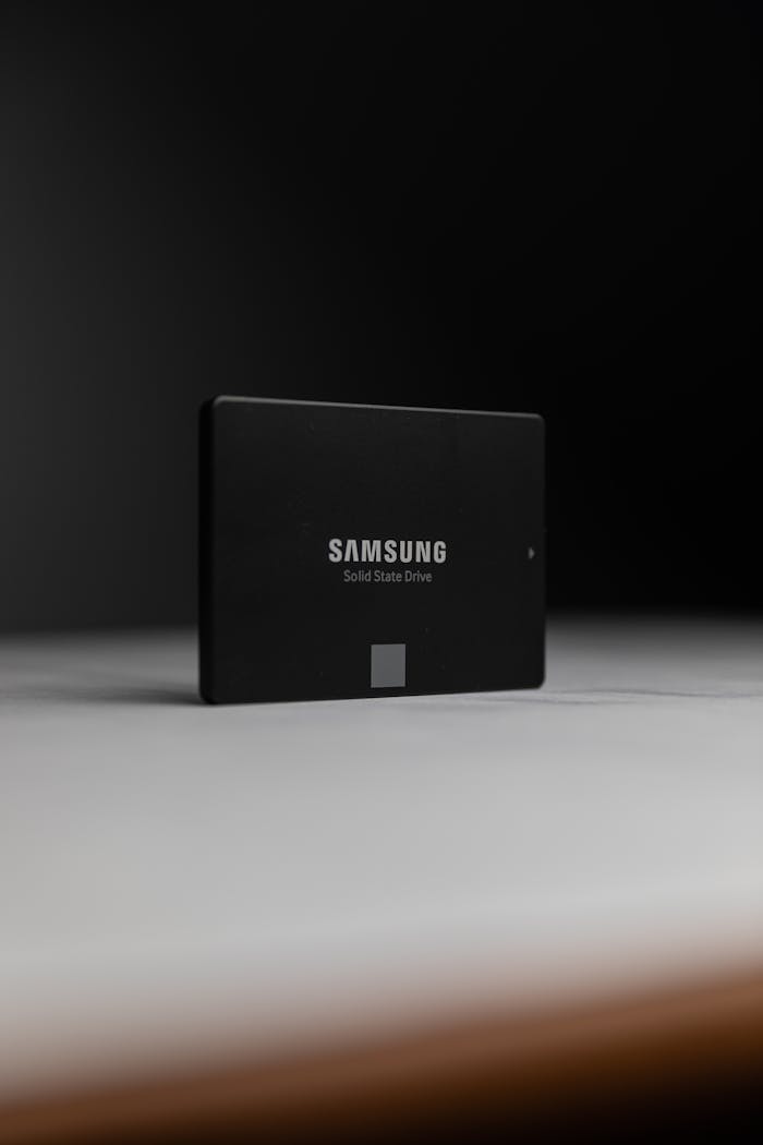 services-02 Close-up of a Samsung solid-state drive on a dark surface, modern technology.